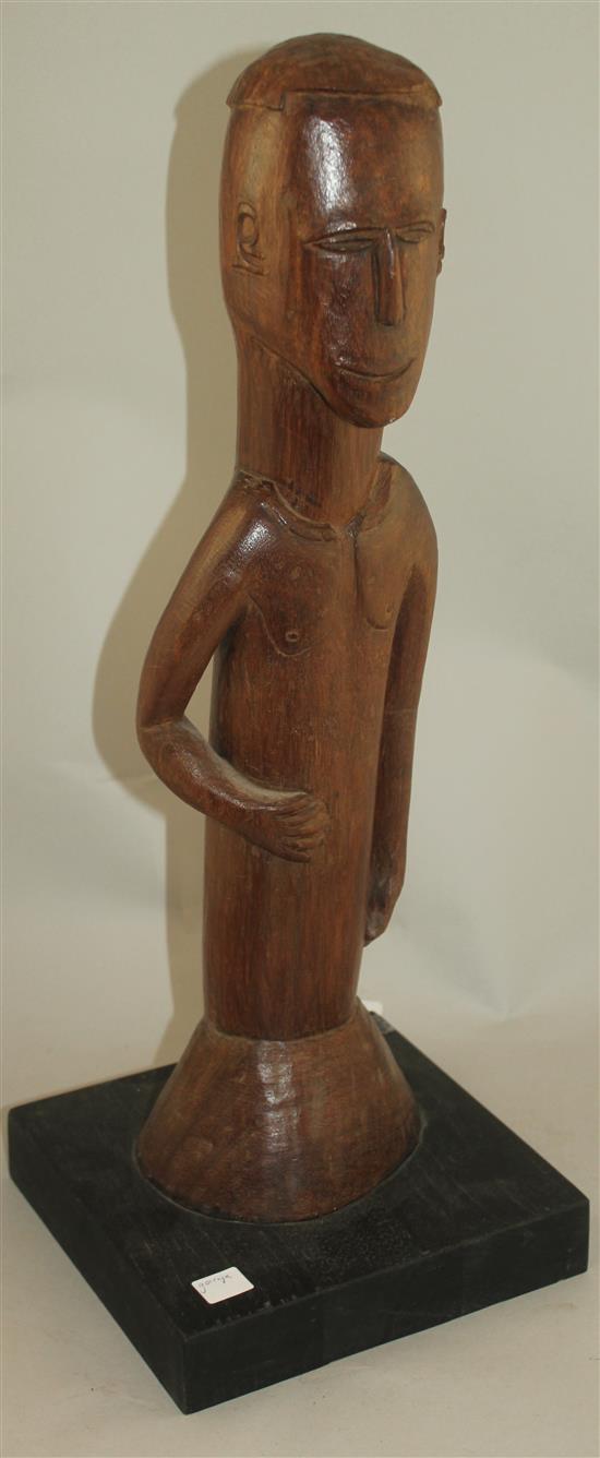 An African Ivory Coast Baule figure of a standing male, largest figure 20.5in.